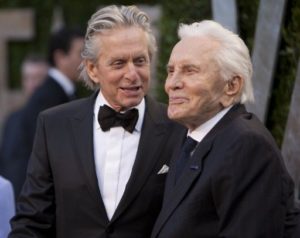 Michael Douglas (L) greets his father Kirk Douglas on the carpet as they arrive at the Vanity Fair Oscar Party, for the 84th Annual Academy Awards, at the Sunset Tower on February 26, 2012 in West Hollywood, California. AFP PHOTO / ADRIAN SANCHEZ-GONZALEZ / AFP PHOTO / ADRIAN SANCHEZ-GONZALEZ
