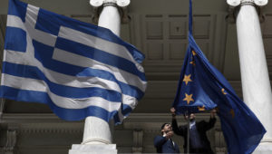epa05194095 Employees of the Greek Foreign Ministry unwrap the flag of the EU before a meeting between Greek Foreign Minister Nikos Kotzias and his Turkish counterpart Mevlut Cavusoglu (both not pictured) in Athens, Greece, 04 March 2016. The bilateral relations and the Greek-Turkish cooperation in the management of the refugee and migrant crisis are expected to dominate their meeting, that comes ahead of an extraordinary EU Summit in Brussels on the same issues on 07 March. The 4th Supreme Greek-Turkish Cooperation Council is also scheduled for 05 March. Mevlut Cavusoglu is paying an official visit to Athens. EPA/ALEXANDROS VLACHOS